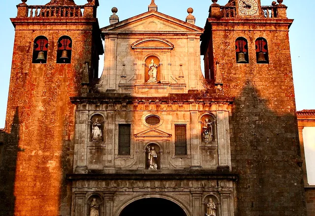 Facade of Viseu Cathedral at dusk, with its two bell towers